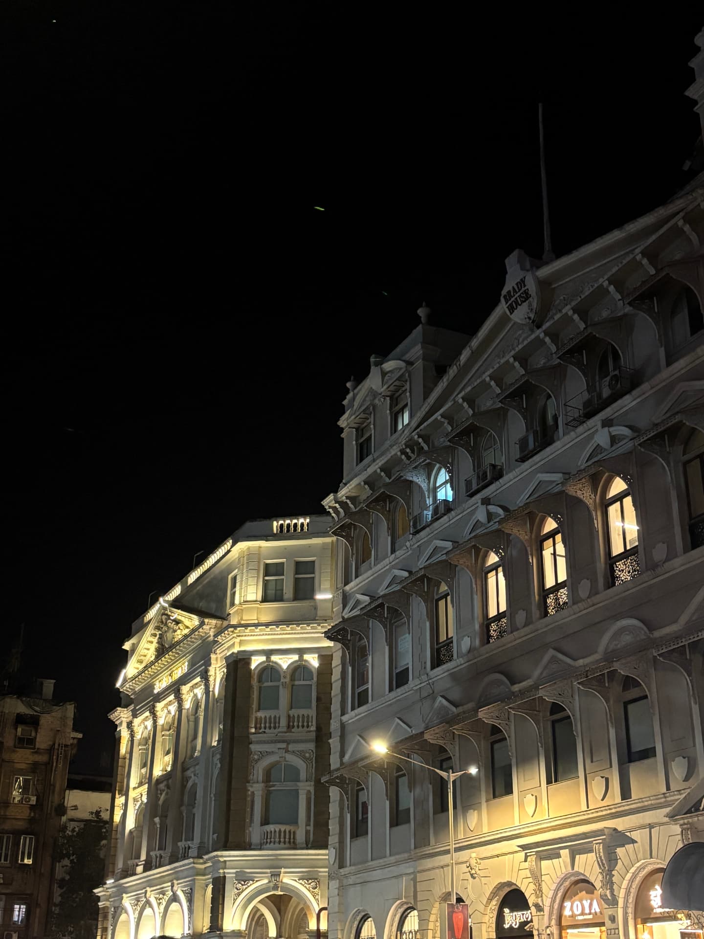 Illuminated historic buildings against the night sky